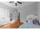 Comfortable bedroom with wood floors, neutral walls, closet, and next to the laundry room at 30 Devilwood Dr, Four Oaks, NC 27524