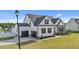 Beautifully designed two-story home with a spacious three-car garage and a well-maintained front lawn at 30 Devilwood Dr, Four Oaks, NC 27524