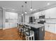 Modern kitchen with stainless steel appliances, granite countertops, and a large island with seating at 30 Devilwood Dr, Four Oaks, NC 27524