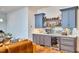 This cozy bar area features custom cabinets, a wine refrigerator, and a stylish backsplash at 301 Georgetown Rd, Raleigh, NC 27608