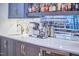 This beverage area features stainless steel beverage machines and a mirror backsplash at 301 Georgetown Rd, Raleigh, NC 27608