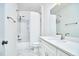 Bathroom with white subway tile, rain shower head, and bright white marble floors at 301 Georgetown Rd, Raleigh, NC 27608