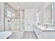 Elegant bathroom boasts clawfoot tub, double vanity, and stylish shower at 301 Georgetown Rd, Raleigh, NC 27608