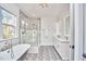 Elegant bathroom boasts clawfoot tub, double vanity, and stylish shower at 301 Georgetown Rd, Raleigh, NC 27608
