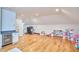 Expansive bonus room featuring hardwood floors, recessed lights and a built-in mini fridge at 301 Georgetown Rd, Raleigh, NC 27608