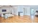 Bright bonus room with hardwood floors features a minibar and beverage cooler, with easy access to bath at 301 Georgetown Rd, Raleigh, NC 27608