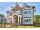 Charming two-story house with brick and siding exterior, dormer windows, and a well-maintained front yard at 301 Georgetown Rd, Raleigh, NC 27608