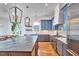 Spacious open concept kitchen with island seating, pendant lighting, and stainless appliances at 301 Georgetown Rd, Raleigh, NC 27608