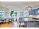 Open concept kitchen and dining area with island seating and natural light at 301 Georgetown Rd, Raleigh, NC 27608