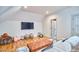 Spacious bonus room with recessed lighting, hardwood flooring, and comfortable seating at 301 Georgetown Rd, Raleigh, NC 27608