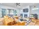 The well-lit living room features hardwood floors, a fireplace, and sliding glass doors to the outdoor deck at 301 Georgetown Rd, Raleigh, NC 27608