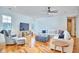 Bright living room features hardwood floors, modern ceiling fan, and comfortable seating at 301 Georgetown Rd, Raleigh, NC 27608