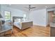 Bright main bedroom featuring hardwood floors and natural light from the windows at 301 Georgetown Rd, Raleigh, NC 27608