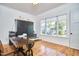 This bright home office features hardwood floors and a large window with a view at 301 Georgetown Rd, Raleigh, NC 27608