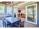 Relaxing screened-in porch with ceiling fan and sliding doors, perfect for entertaining at 301 Georgetown Rd, Raleigh, NC 27608