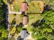 Aerial shot highlighting the house, lawn and treed property at 3016 Fields Dr, Raleigh, NC 27603