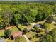 Aerial view of a neighborhood surrounded by a dense forest at 3016 Fields Dr, Raleigh, NC 27603