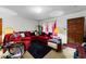 Inviting living room featuring a cozy red sofa, plush textures, and a warm ambiance at 3016 Fields Dr, Raleigh, NC 27603