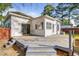Deck for outdoor enjoyment, surrounded by the home's well-maintained backyard and mature trees at 302 N Sumner St, Selma, NC 27576