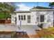 Outdoor deck perfect for entertaining, set in a private backyard with mature trees and grass at 302 N Sumner St, Selma, NC 27576