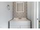 Bathroom featuring a modern sink and stylish floral wallpaper at 302 N Sumner St, Selma, NC 27576