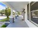 Inviting front porch with classic columns, painted floors, and charming curb appeal at 302 N Sumner St, Selma, NC 27576