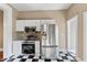 Modern kitchen features stainless steel appliances, white cabinets, and a checkered floor at 302 N Sumner St, Selma, NC 27576