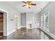 Bright living room boasts hardwood floors, a decorative fireplace, built-in shelves, and abundant natural light at 302 N Sumner St, Selma, NC 27576