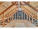 A view of an unfinished attic or storage space with wood framing and unfinished flooring at 308 Ravenstone Dr, Cary, NC 27518