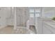 Stylish bathroom features glass shower, separate soaking tub, and white vanity at 308 Ravenstone Dr, Cary, NC 27518