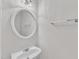 Neat bathroom with a white sink, a mirror, and a towel rack, presenting a simple yet functional space at 308 Ravenstone Dr, Cary, NC 27518
