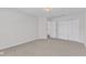 This bedroom is bright, featuring neutral carpet and closet with ample storage at 308 Ravenstone Dr, Cary, NC 27518