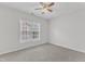 Simple bedroom with neutral carpet and a window bringing natural light to the room at 308 Ravenstone Dr, Cary, NC 27518