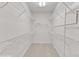 Spacious walk-in closet with ample shelving, offering generous storage for organization and convenience at 308 Ravenstone Dr, Cary, NC 27518