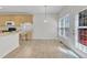 Sunny dining area adjacent to kitchen with breakfast nook and patio access at 308 Ravenstone Dr, Cary, NC 27518