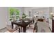 Elegantly staged dining room with a hardwood table and decor at 308 Ravenstone Dr, Cary, NC 27518