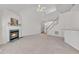 Inviting living area with fireplace, open staircase, and breakfast bar view at 308 Ravenstone Dr, Cary, NC 27518