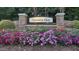 Coventry Glen neighborhood entrance sign welcomes with colorful flowers and stone pillars at 308 Ravenstone Dr, Cary, NC 27518
