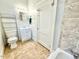 Neutral bathroom featuring updated tiling, fixtures, and ample space at 309 19Th St, Butner, NC 27509