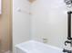 This bathroom features a white tiled shower with a shower/tub combo at 315 King George Loop, Cary, NC 27511