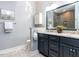 Modern bathroom with dual sinks, granite countertops, and a tiled shower at 315 King George Loop, Cary, NC 27511