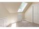 This bedroom features a skylight window, neutral walls, and neutral carpeting at 315 King George Loop, Cary, NC 27511
