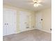 This bedroom features three closets, neutral walls, and neutral carpeting at 315 King George Loop, Cary, NC 27511