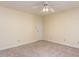This bedroom features neutral walls, a ceiling fan, and neutral carpeting at 315 King George Loop, Cary, NC 27511