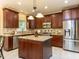 Gourmet kitchen features custom cabinets and a large center island at 315 King George Loop, Cary, NC 27511
