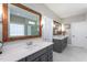Luxurious bathroom with dual sink vanity, framed mirrors, and great lighting at 3209 Star Gazing Ct, Wake Forest, NC 27587