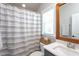 Bathroom features a large vanity, a toilet, and a shower with striped curtain at 3209 Star Gazing Ct, Wake Forest, NC 27587