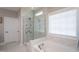 Bathroom featuring a tub, glass enclosed shower with multiple shower heads at 3209 Star Gazing Ct, Wake Forest, NC 27587