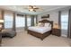 Bright main bedroom with decorative ceilings, neutral carpet, and abundant natural light at 3209 Star Gazing Ct, Wake Forest, NC 27587