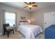 Cozy bedroom featuring natural lighting, neutral tones, and a ceiling fan at 3209 Star Gazing Ct, Wake Forest, NC 27587